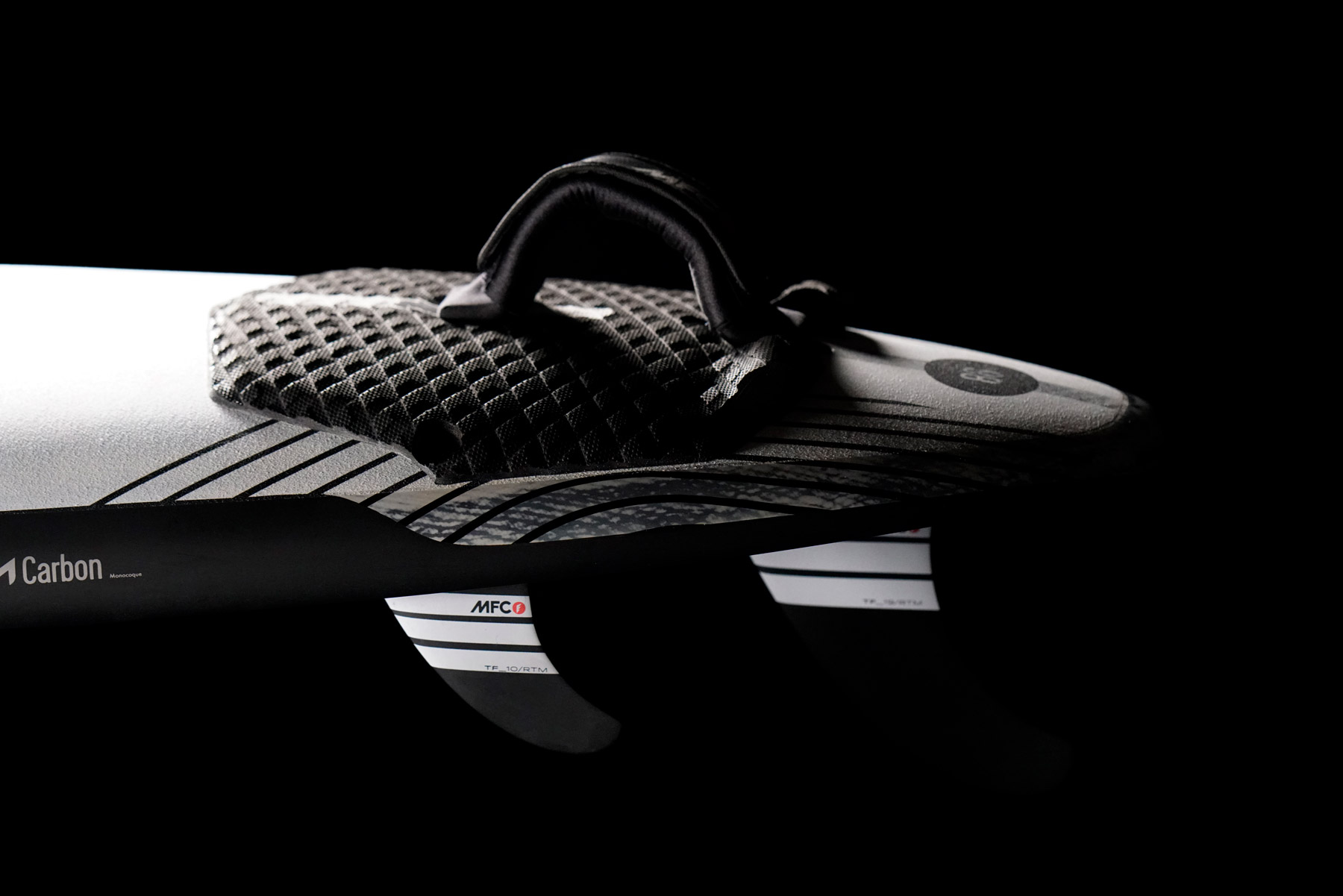 Detail of MFC carbon windsurf fins and footstraps